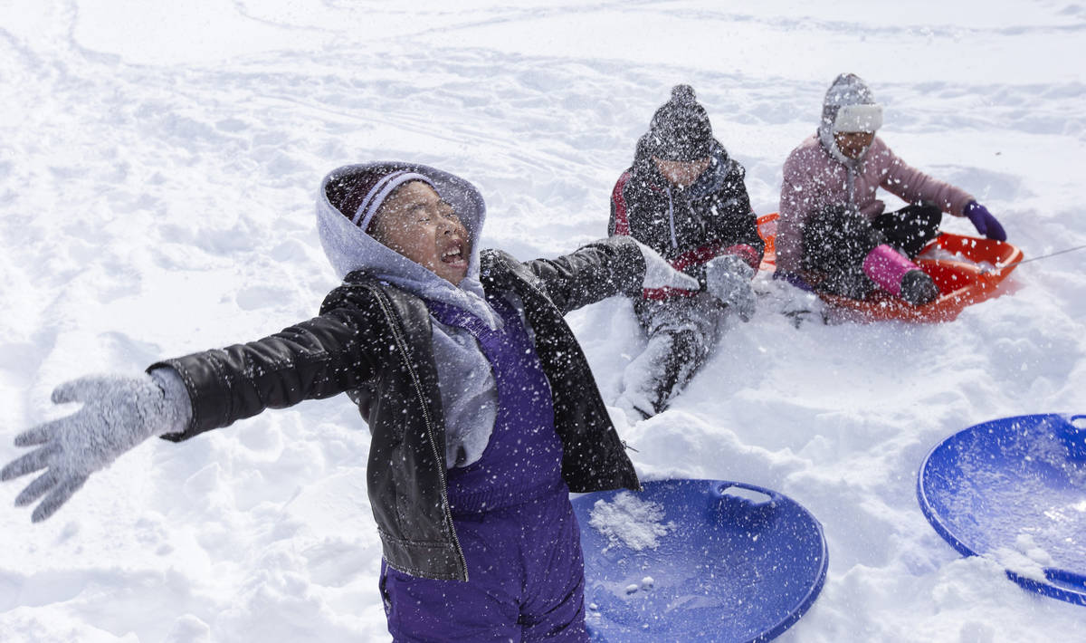 Ellen Schmidt/Las Vegas Review-Journal Matthew Pham, 4, of Las Vegas, left, throws snow into th ...