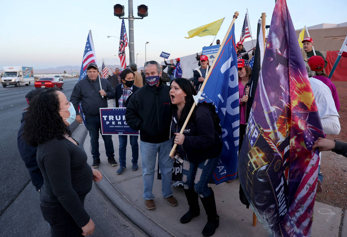 K.M. Cannon/Las Vegas Review-Journal Supporters of President Donald Trump argue with supporters ...