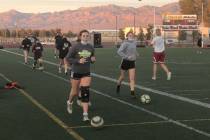 Tom Rysinski/Pahrump Valley Times Girls soccer players warm up before a conditioning session wh ...