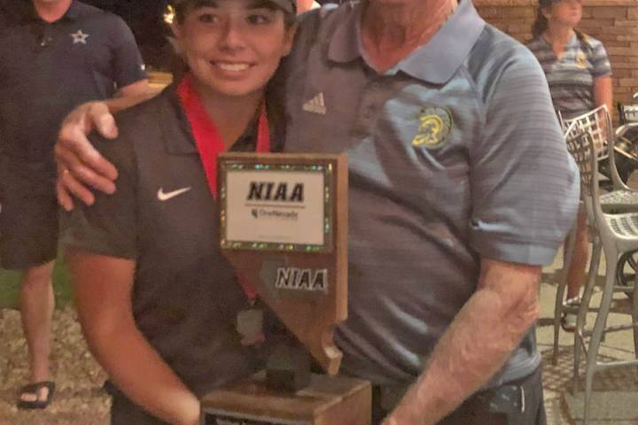 File photo Then-junior Breanne Nygaard and PVHS golf coach Bob Hopkins pose with the trophy aft ...