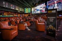 L.E. Baskow/Special to the Pahrump Valley Times People watch events as the Westgate sportsbook ...