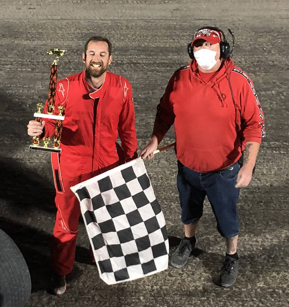 Tom Rysinski/Pahrump Valley Times Kyle Renberger, left, accepts the trophy from flagman Dale Ge ...