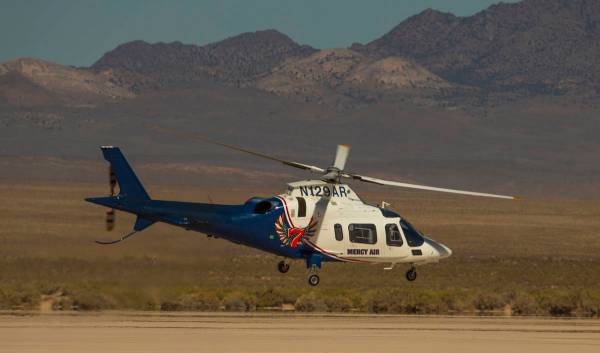 L.E. Baskow/Las Vegas Review-Journal A Mercy Air helicopter lifts off on its way to a rollover ...