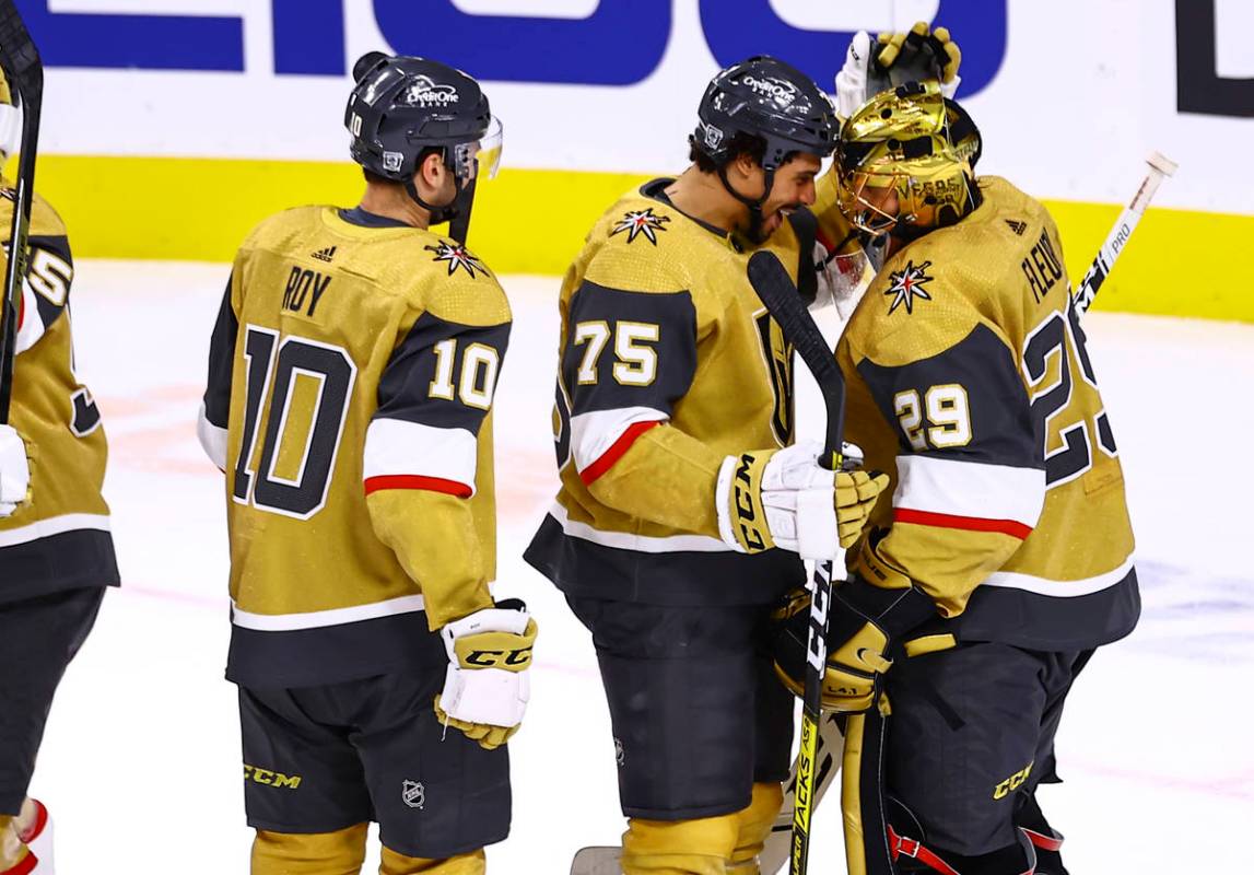 Golden Knights right wing Ryan Reaves (75) celebrates a 1-0 shutout win with goaltender Marc-An ...