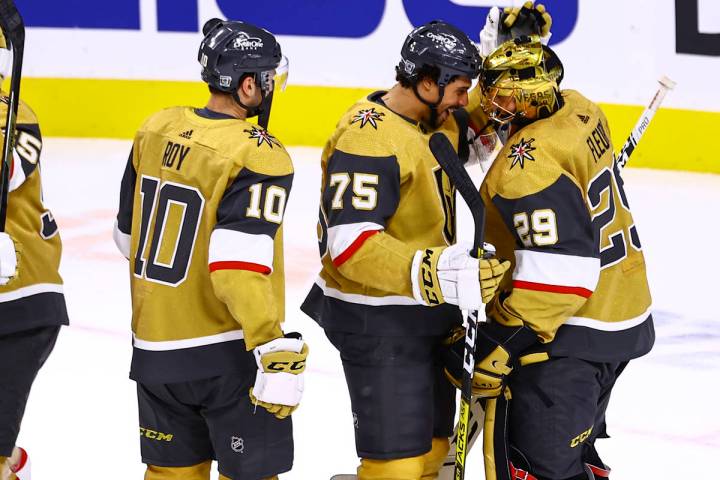 Golden Knights right wing Ryan Reaves (75) celebrates a 1-0 shutout win with goaltender Marc-An ...