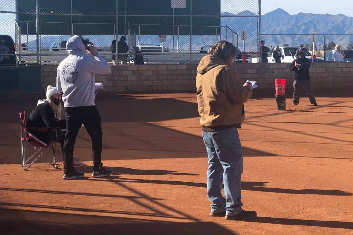 Tom Rysinski/Pahrump Valley Times Coaches watch as Richard Swingle hits ground balls during the ...