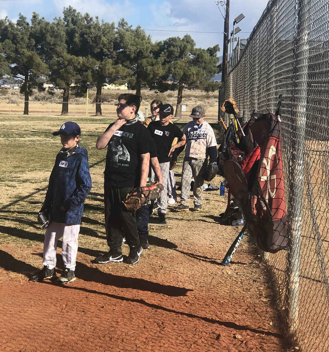 Tom Rysinski/Pahrump Valley Times Prospective baseball players line up for their turn at fieldi ...