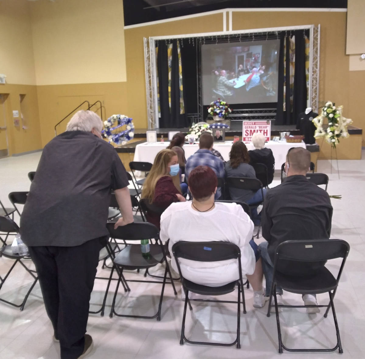 Selwyn Harris/Pahrump Valley Times Family, friends and colleagues watched a photo presentation ...