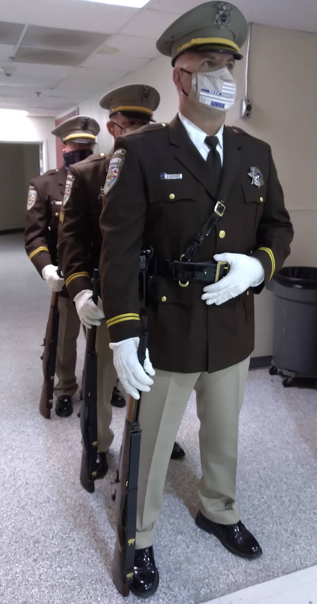 Selwyn Harris/Pahrump Valley Times Members of the Nye County Sheriff's Office Honor Guard stand ...