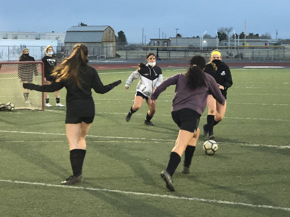 Tom Rysinski/Pahrump Valley High School Girls soccer players do a 2-on-2 drill during March 3 p ...