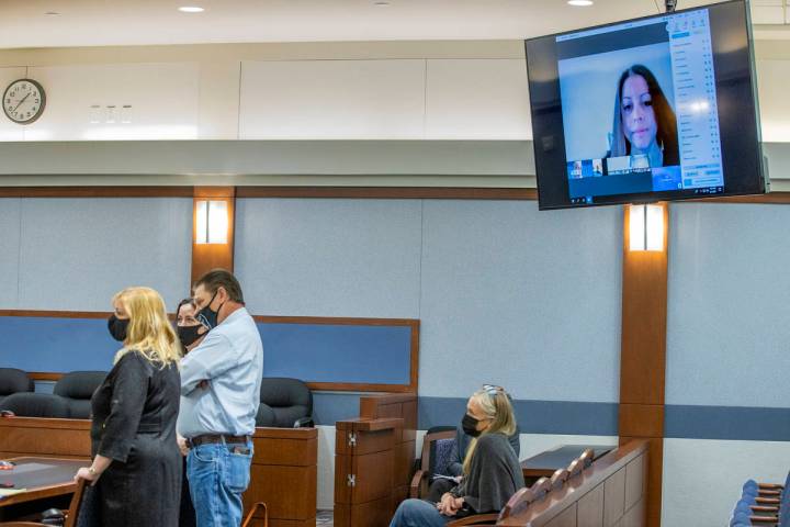 (From left) Attorney Lisa Rasmussen, attorney Kristina Wildeveld, Fred Steese and others listen ...