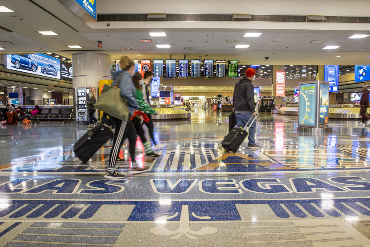 L.E. Baskow/Las Vegas Review-Journal People come and go through baggage at Terminal 1 as holida ...