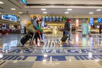 L.E. Baskow/Las Vegas Review-Journal People come and go through baggage at Terminal 1 as holida ...