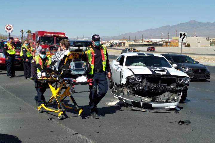 Selwyn Harris/Pahrump Valley Times The driver of a late model Dodge Challenger was transported ...