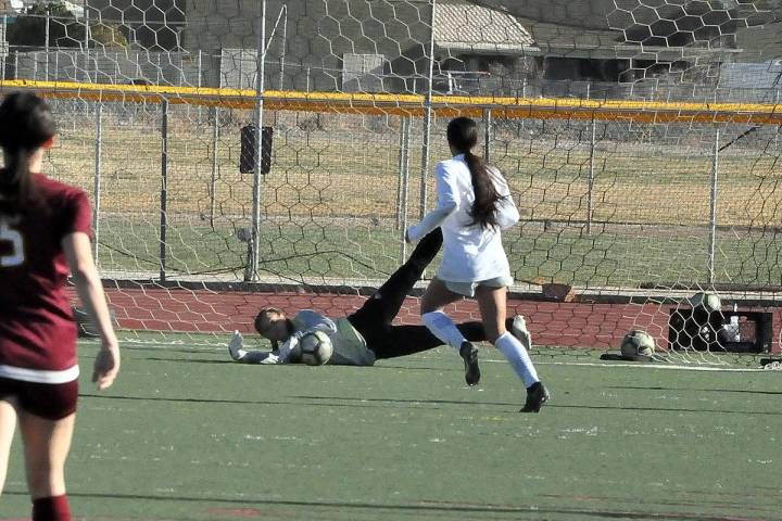 Horace Langford Jr./Pahrump Valley Times Freshman keeper Avery Moore dives to make a save durin ...