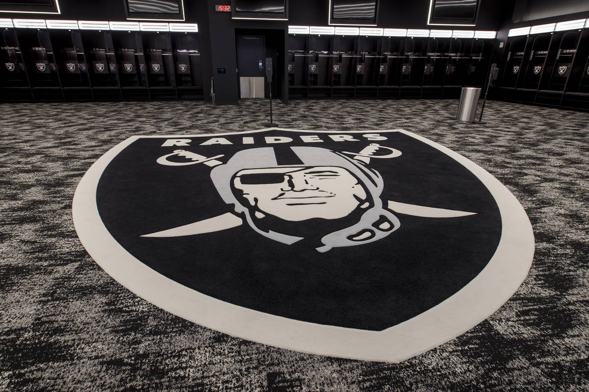 The locker room for the Las Vegas Raiders features a large logo and plenty of room to move for ...