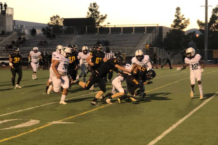 Tom Rysinski/Pahrump Valley Times Pahrump Valley running back Henry Amaya surges deep in SLAM N ...