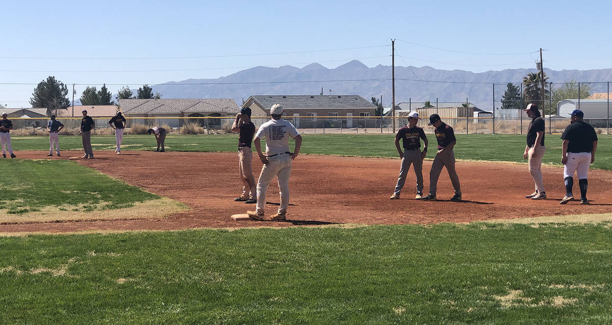 Tom Rysinski/Pahrump Valley Times Players were divided among the four bases for a running drill ...