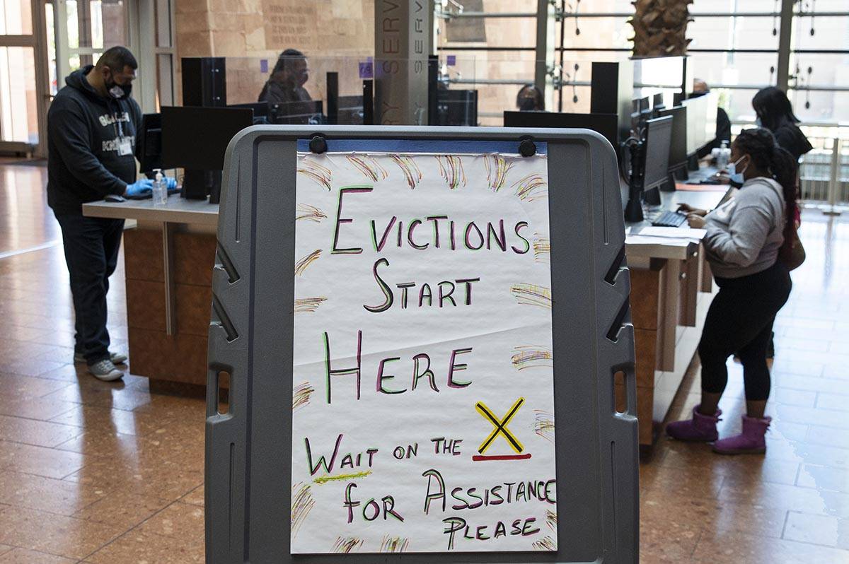 Tenants who received an eviction notice from their landlord, fill out forms at the Civil Law Se ...