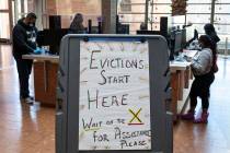 Tenants who received an eviction notice from their landlord, fill out forms at the Civil Law Se ...