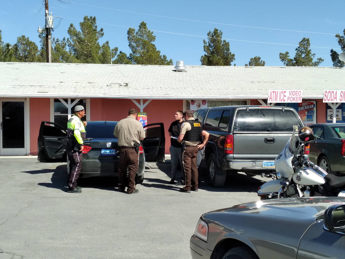 Selwyn Harris/Pahrump Valley Times Nye County Sheriff's Office deputies and detectives question ...