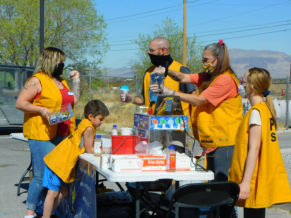 Robin Hebrock/Pahrump Valley Times Members of PDOP are pictured preparing snow cones, which wer ...
