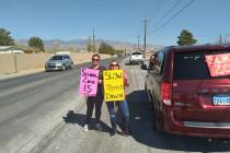 Selwyn Harris/Pahrump Valley Times Lynn Olds, left, and Sarah Barentine routinely hold signs in ...