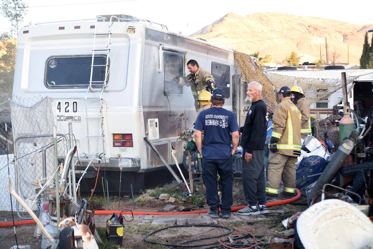 Richard Stephens/Special to the Pahrump Valley Times Wayne Hale (middle) speaks with Fire Chie ...