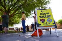 Chase Stevens/Las Vegas Review-Journal People wait in line at the COVID-19 vaccination site at ...