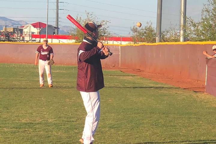 Tom Rysinski/Pahrump Valley Times Assistant baseball coach Drew Middleton hits ground balls to ...