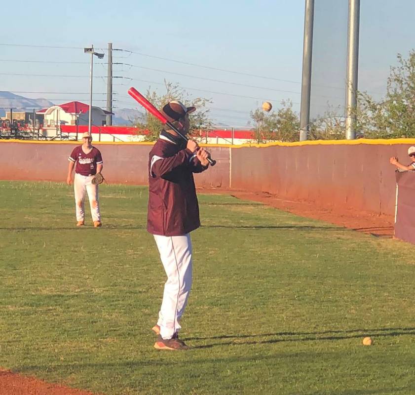 Tom Rysinski/Pahrump Valley Times Assistant baseball coach Drew Middleton hits ground balls to ...