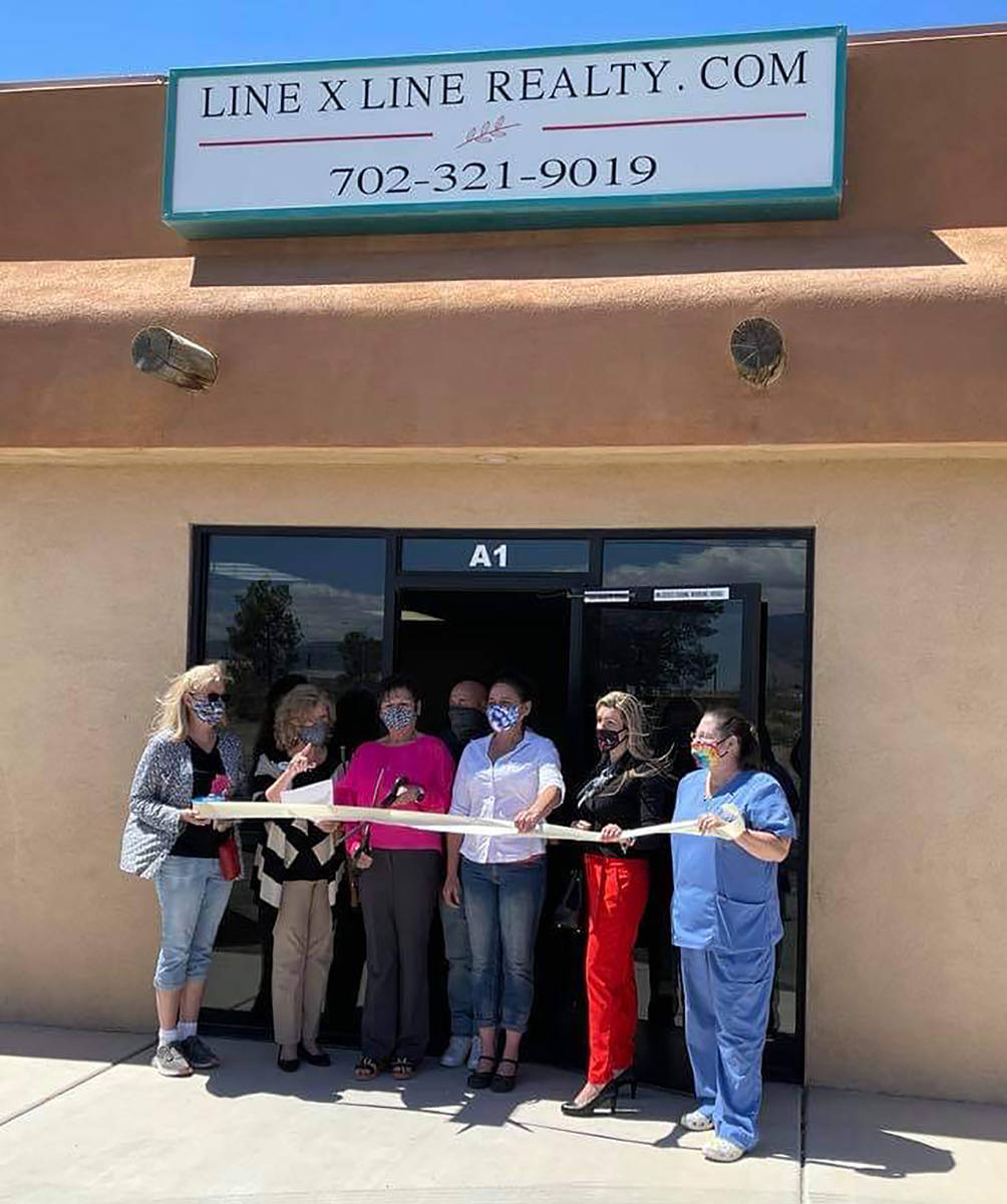 Bianca Graeff/Pahrump Valley Times Pahrump Chamber of Commerce officials and community members ...