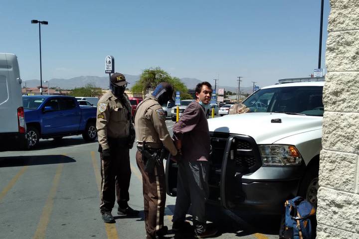 Selwyn Harris/Pahrump Valley Times Nye County Sheriff's Office Deputies secure the arrest of a ...