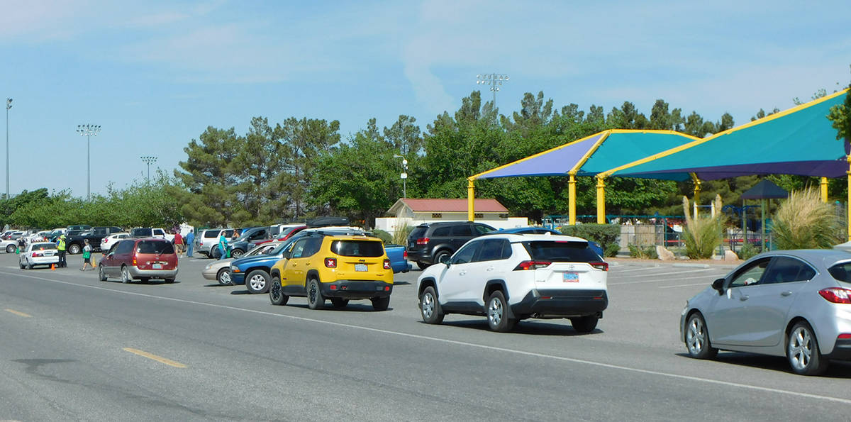 Robin Hebrock/Pahrump Valley Times A long line of cars can be seen waiting their turn to receiv ...