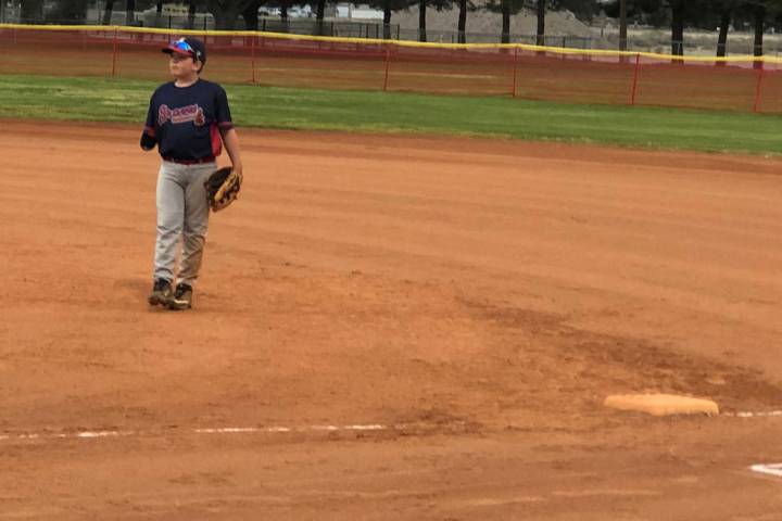 Tom Rysinski/Pahrump Valley Times Austin Abelar stands ready at first base for the Braves durin ...