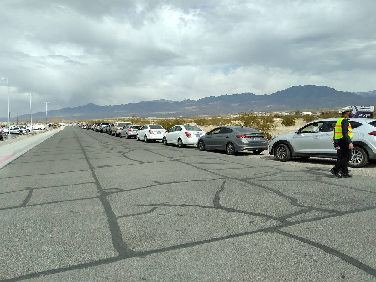 Selwyn Harris/Pahrump Valley Times Dozens of drivers and passengers lined up along Floyd Street ...