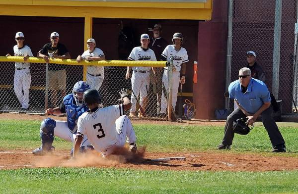 Horace Langford Jr./Pahrump Valley Times Freshman Justin Ybarra is tagged out trying to score o ...