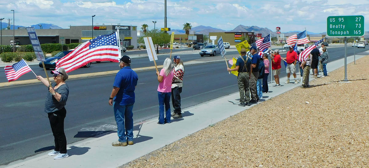 Robin Hebrock/Pahrump Valley Times Stand in Solidarity rally attendees are seen waving flags an ...