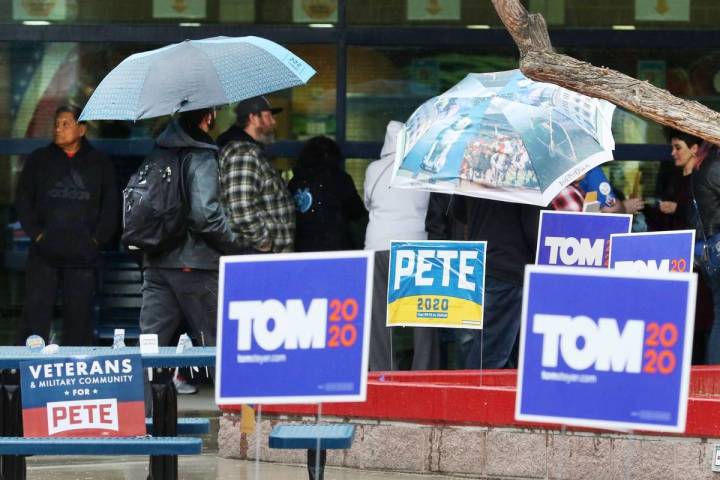 Democratic caucus-goers stand in line at the caucus site at Liberty High School on Saturday, Fe ...