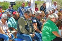 Robin Hebrock/Pahrump Valley Times Community members bow their heads in prayer during the Memor ...