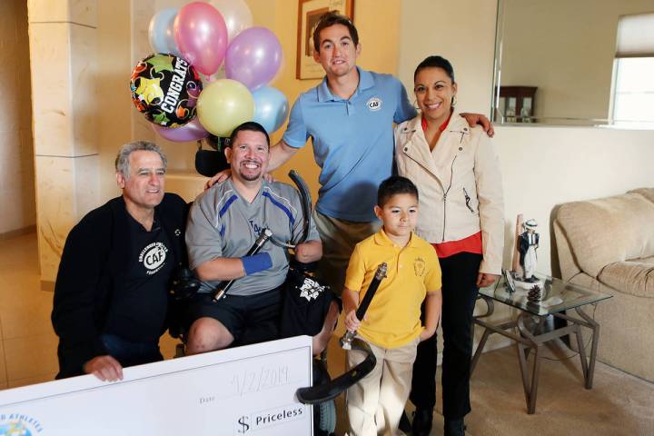 File From left, Challenged Athletes Foundation co-founder Bob Babbitt, Eddie Garcia, Paralympic ...