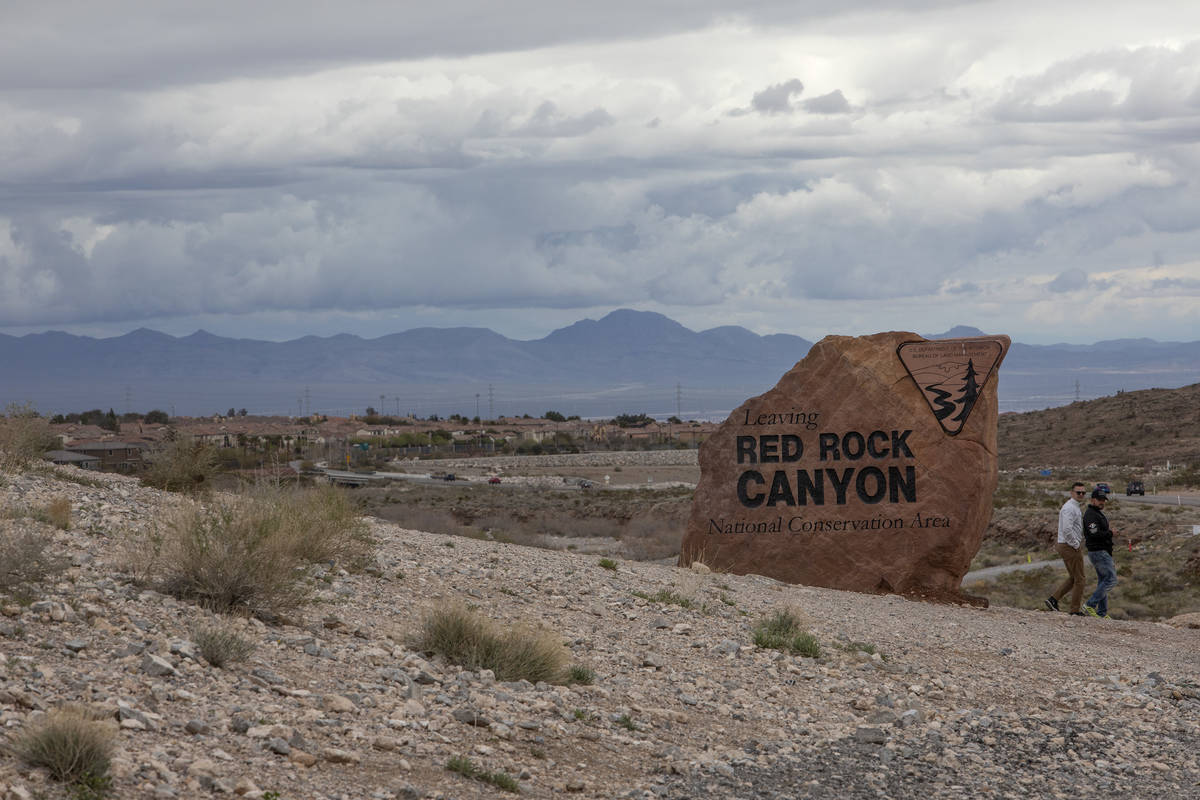 Tourists leave after taking selfies by the Red Rock Canyon sign on Friday, March 13, 2020, in L ...