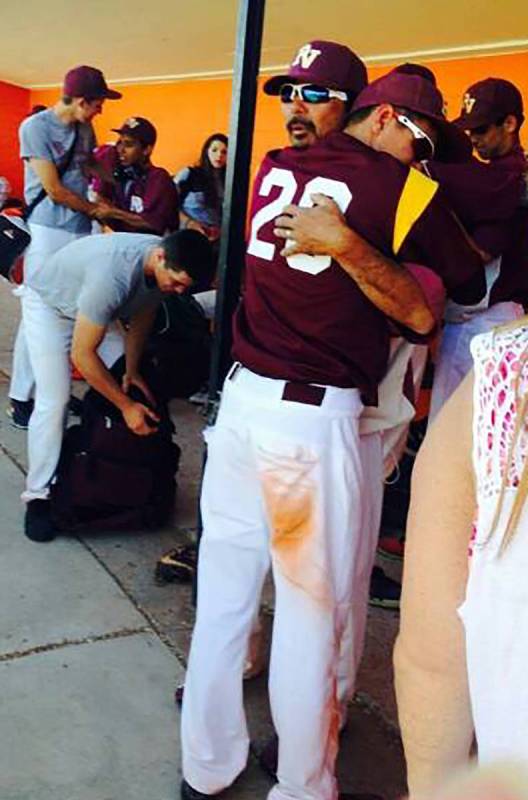 File photo Pahrump Valley High School assistant baseball coach Roy Uyeno gets a hug from senior ...