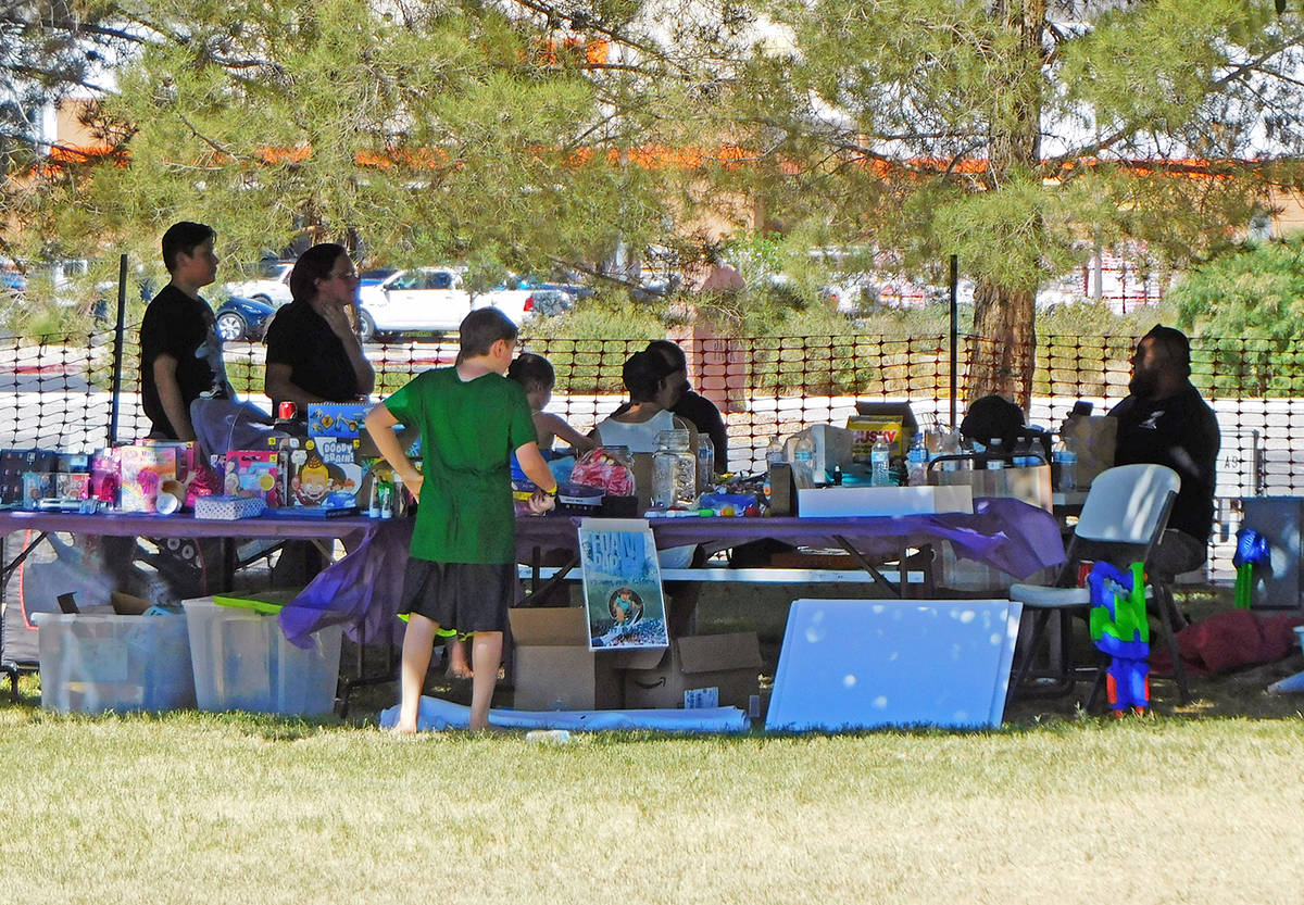Robin Hebrock/Pahrump Valley Times A young Wet Wild Water War attendee is seen examining the ra ...