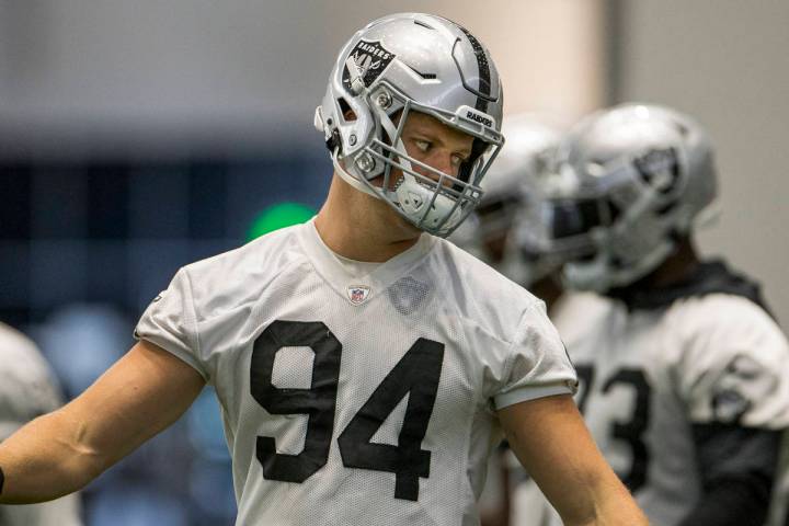 Las Vegas Raiders defensive end Carl Nassib (94) twists his body during warm ups at the Intermo ...