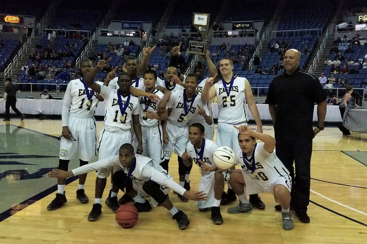 File photo Spring Mountain basketball players celebrates after winning the Class 1A state title ...