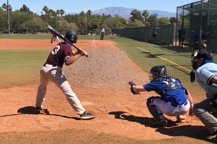 Tom Rysinski/Pahrump Valley Times Justyn Ybarra keeps his eye on a pitch that he sent to the fe ...