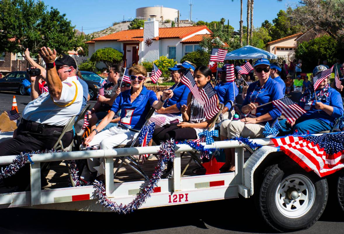 Blue Star Mothers of Nevada wave flags while participating in the parade at the annual Damboree ...