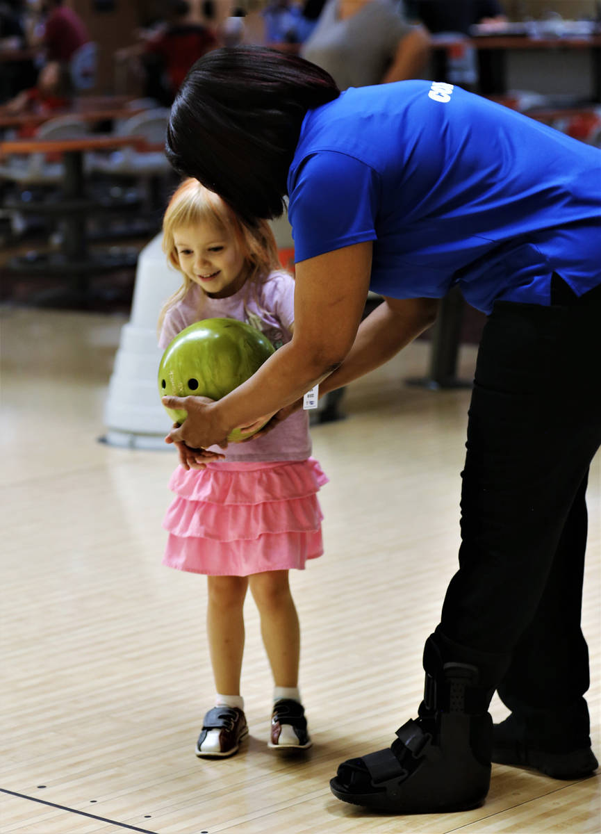 Randy Gulley/Special to the Pahrump Valley Times Bridjette Whaley prepares a young bowler for h ...