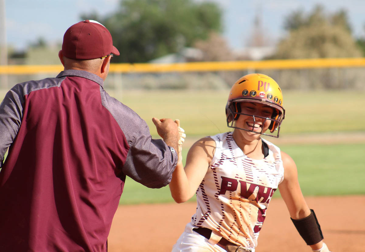 File photo Pahrump Valley High School's Skyler Lauver rounds third to congratulations from fath ...